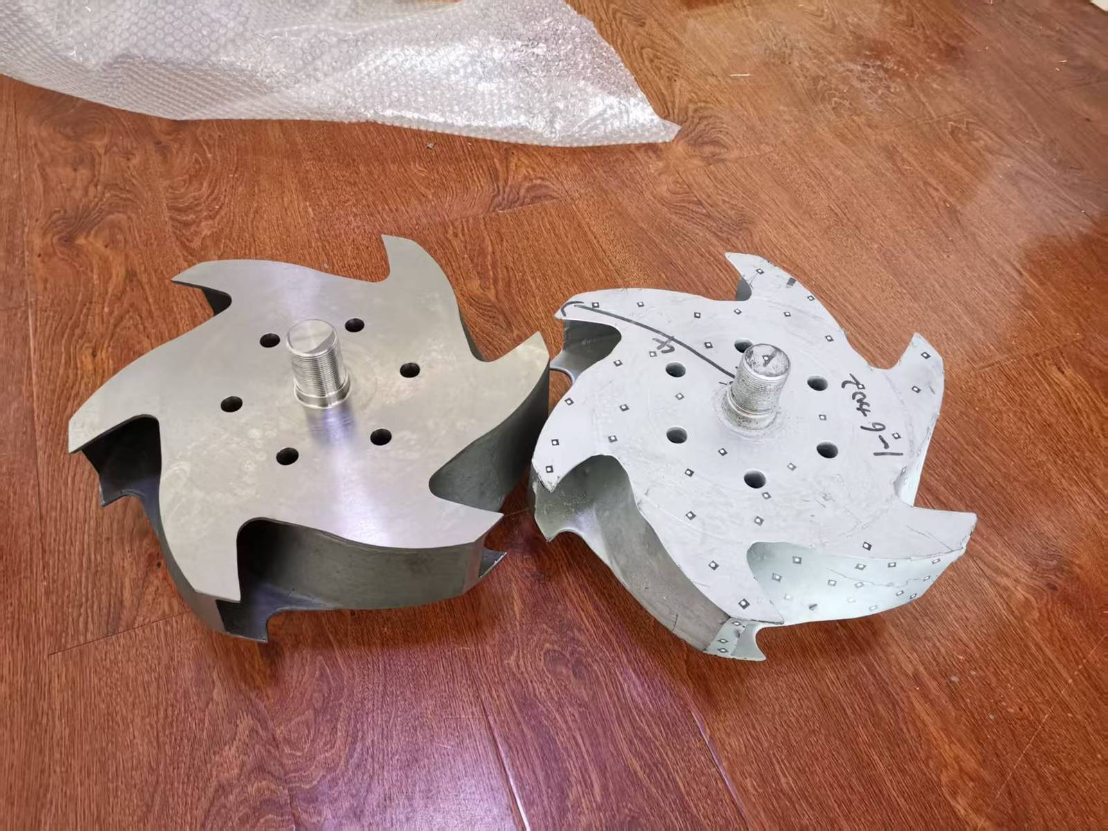 Back view of the customer's sample impeller and the reverse engineered replacement side by side